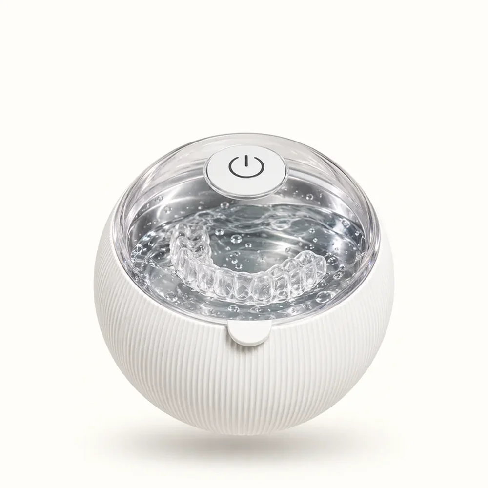Smile Lab USA ultrasonic cleaner, compact spherical design with one-touch power button